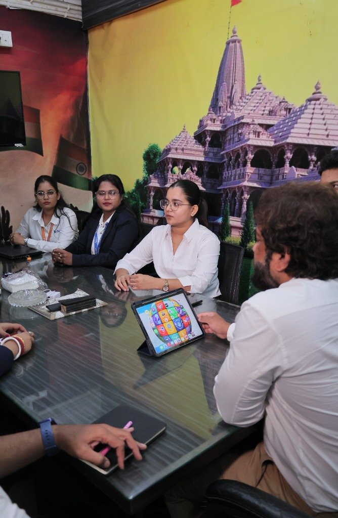 iNext Software team in office meeting